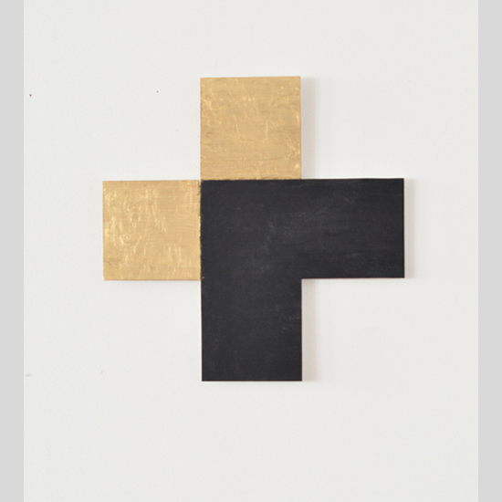 This wall sculpture by Sjack Marks is created from two sides of a gold square over layed by two sides of a black square