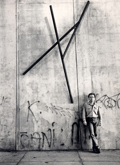 This photograph is of the artist Sjak Marks with Lass Uns Frei Sein, this permanent steel wall work is installed on Fairmount Avenue near Second Street in Philadelphia, PA, USA