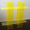 Yellow Plexiglas table the edges of which appear luminous by artist Sjak Marks